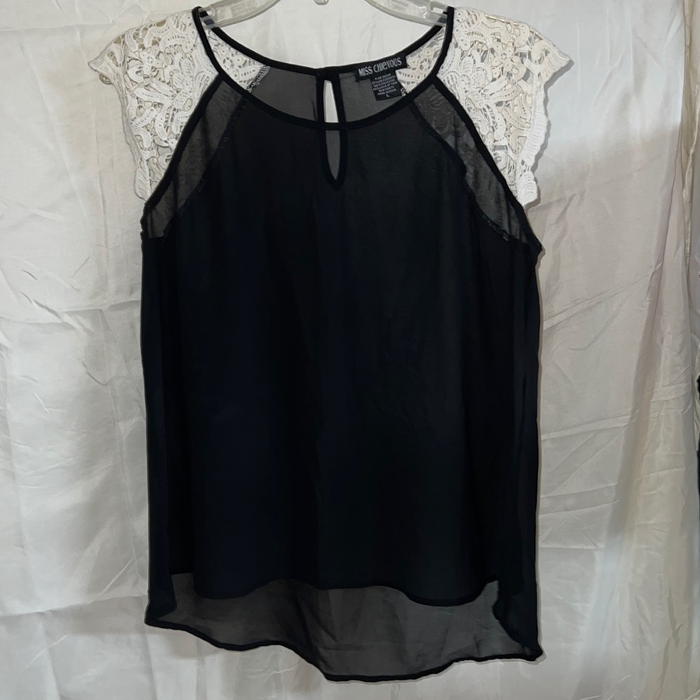 Black top with lace cream sleeves